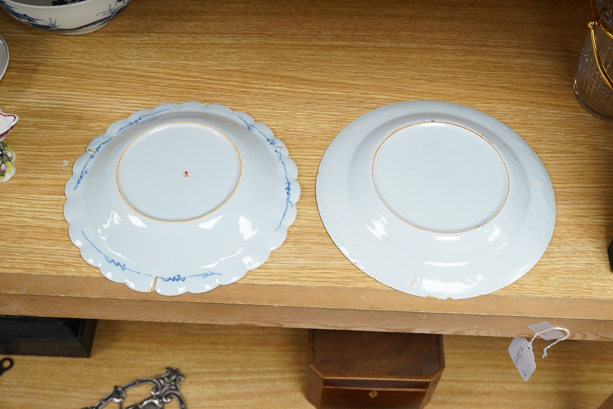 Two 18th century English delftware plates, one with bianco sopra bianco detail, 23cm diameter. Condition - fair